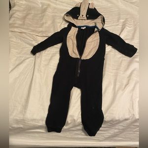Black and off white/tan skunk onsie